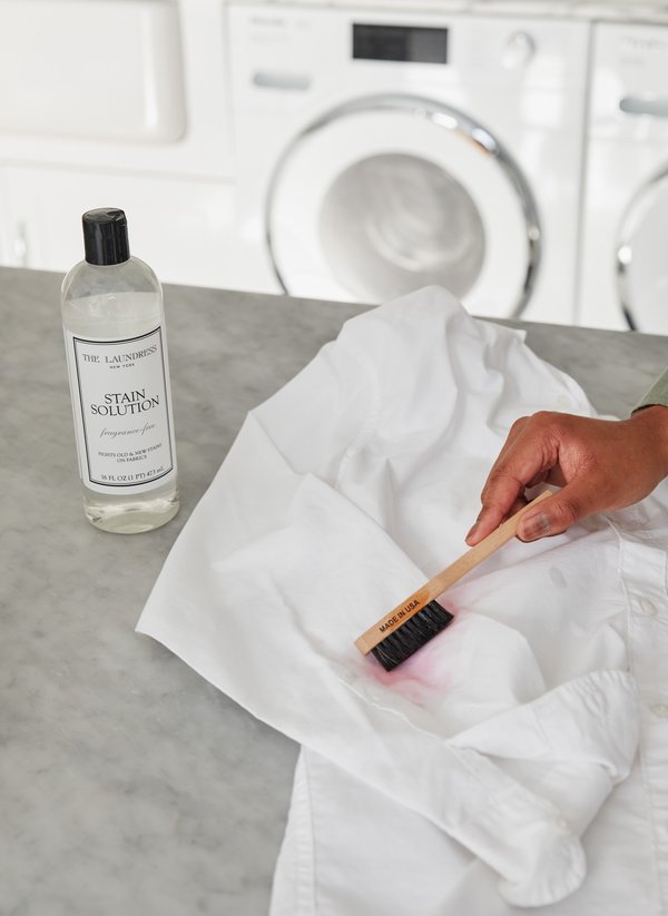 The Laundress products on laundry shelf The Laundress products sitting on laundry room shelf