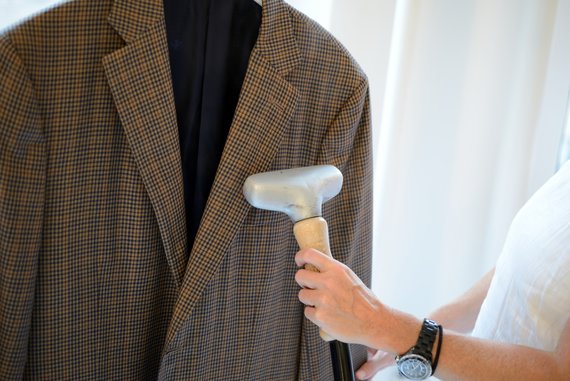 Person steaming blazer Person steaming blazer
