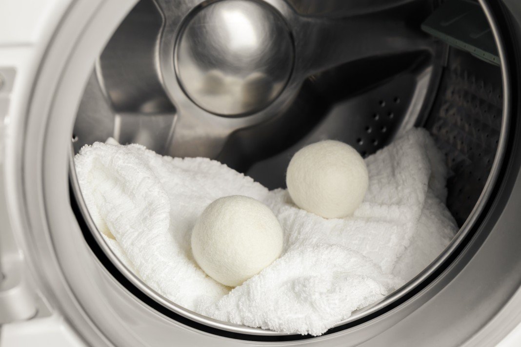 Several wool dryer balls in a clothes dryer