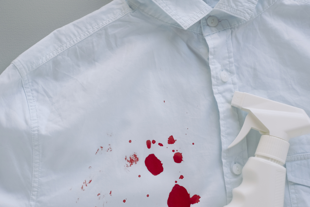 shutterstock_1813650319 A white shirt with fake blood stains on it.
